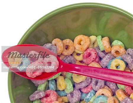 Vibrant Bowl with Breakfast Cereal Close Up with Cereal on Spoon.