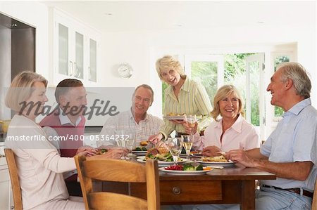 Friends Enjoying Lunch At Home Together