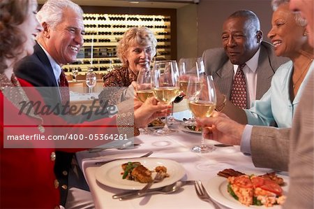 Friends Having Dinner Together At A Restaurant