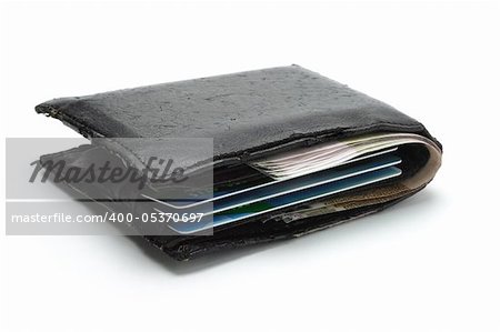 Old wallet with cash and credit cards on white background