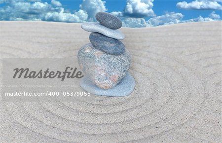 pyramid with five stones on sand and sky background