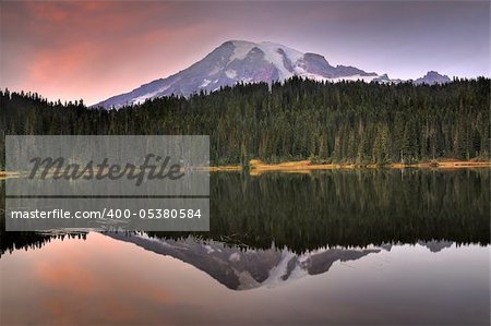 Striking image of Mount Rainier perfectly reflected across the reflection lakes at dusk