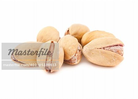 Toasted pistachios isolated on a white background