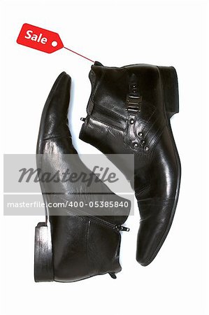 Leather boots isolated against a white background  Modern boots isolated against a white background