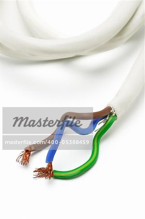 White power cable exposing strands of copper wires on white background