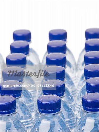 Rows of water bottles isolated on white background