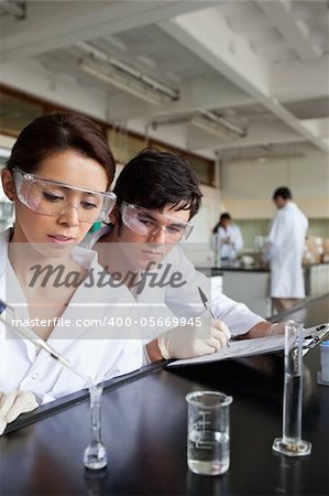 Portrait of young science students working in a laboratory