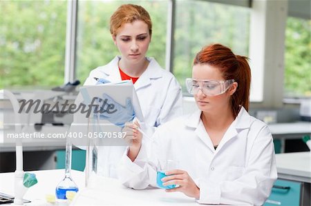 Young science students doing an experiment in a laboratory