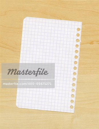 Blank paper note on a wooden background
