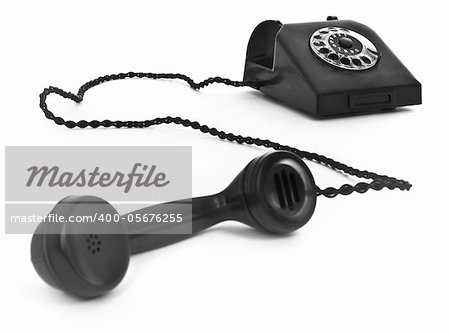 old bakelite telephone on white background, focus set in background