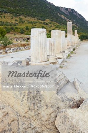 Pillars and collumns next to the main road in the old ruins of the city of Ephesus in modern day Turkey