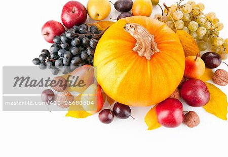 autumnal fruit with yellow leaf isolated on white background