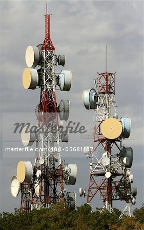 telecommunication two towers, with a lot of different antennas