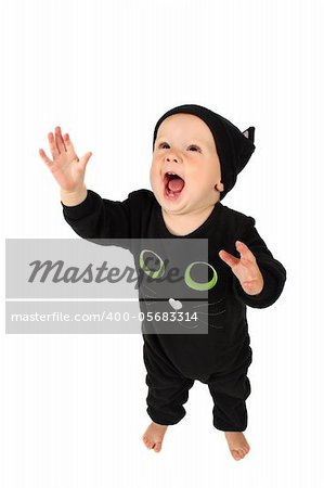 Baby girl dressed in a halloween cat costume on white background