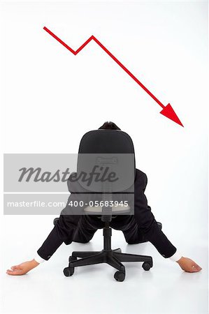 businessman lying on the chair and watching the red down graph