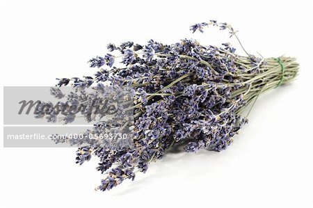 a bundle of dried lavender on a white background