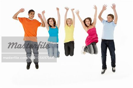Group Of Five Young Children Jumping In Studio