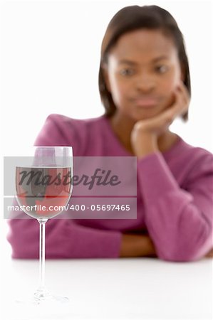 Woman Looking At Glass Of Wine