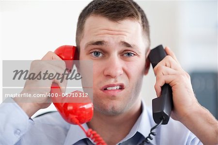 Close up businessman overextended with the phone