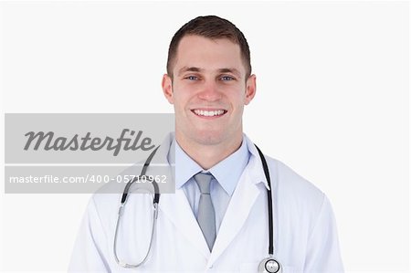 Close up of confident smiling doctor on white background