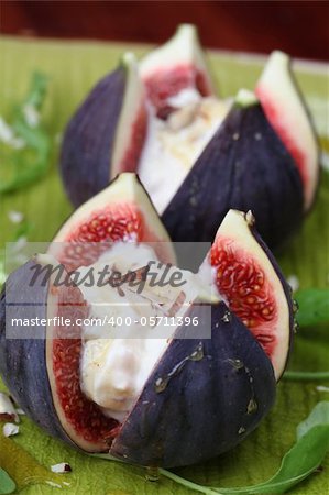 Figs with nut and honey cheese. Shallow dof