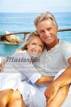 Close-up portrait of a happy romantic couple outdoors.