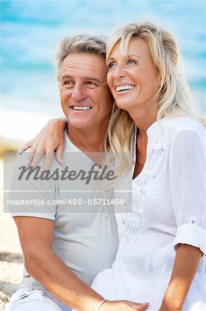 Close-up portrait of a happy romantic couple outdoors.