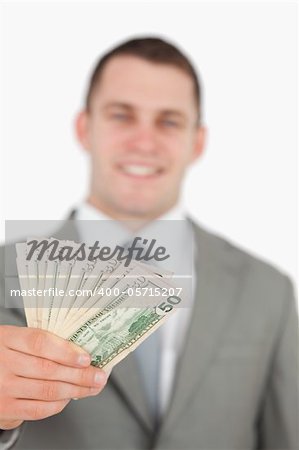 Portrait of a smiling businessman showing notes against a white background