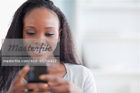 Close up of smiling woman typing text