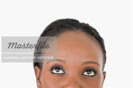 Close up of young woman's forehead on white background