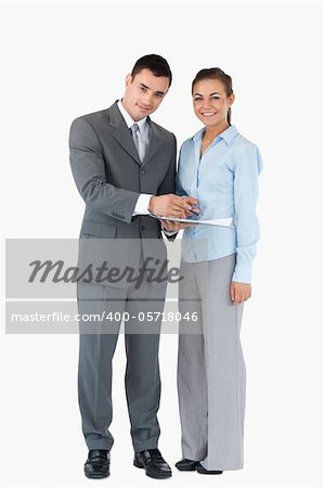 Young business partner with clipboard against a white background