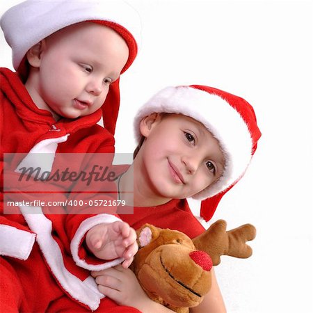 two boy in Santa costumes together