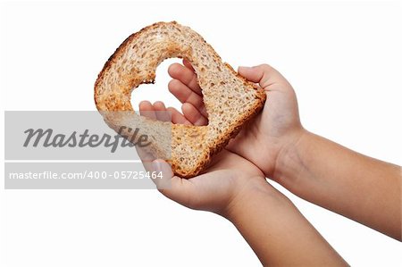 Giving food with love concept - slice of bread in child hands, isolated