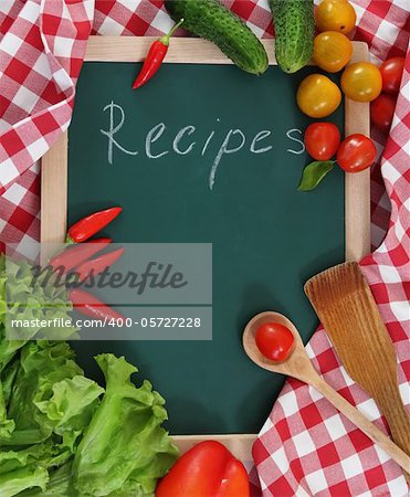 Vegetables still life with recipes blank on checkered background