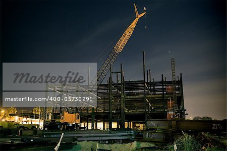 Long exposure night shot on construction site with crane. No logos!