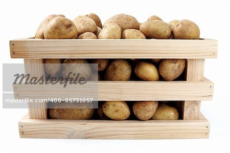 whole potatoes in wooden box