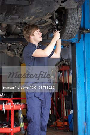 Mechanic working on car
