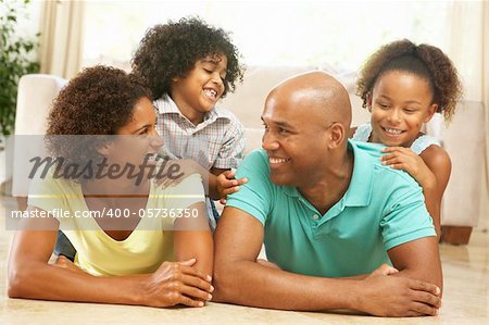 Family Relaxing At Home Together