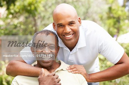 Senior Man Hugging Adult Son