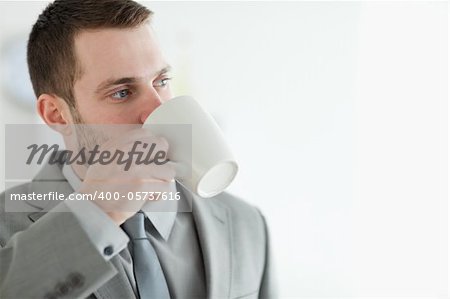 Businessman drinking tea in his kitchen