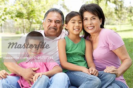 Grandparents In Park With Grandchildren