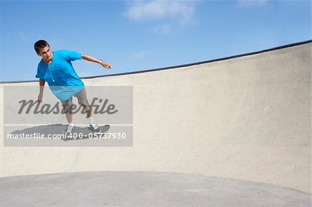 Teenage Boy In Skateboard Park