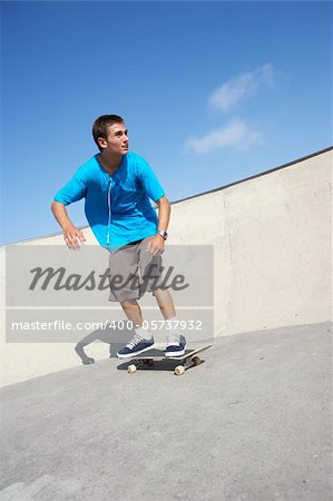 Teenage Boy In Skateboard Park