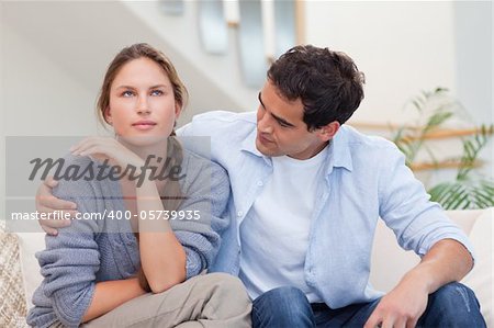 Woman being mad at her husband in their living room