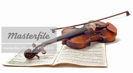 beautiful violin and sheet music isolated on a white background