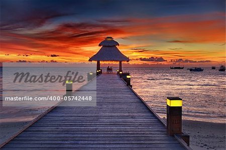 Awsome vivid sunset over the jetty in the Indian ocean, Maldives. HDR