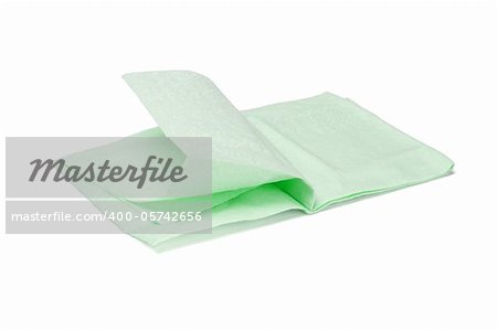 Green folded facial tissue paper on white background