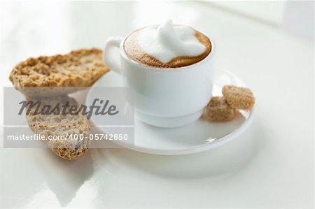 Close up of a small cup of cappuccino
