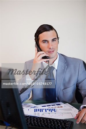 Businessman on his desk having a phone call