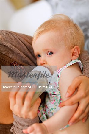 Baby feeding by mother